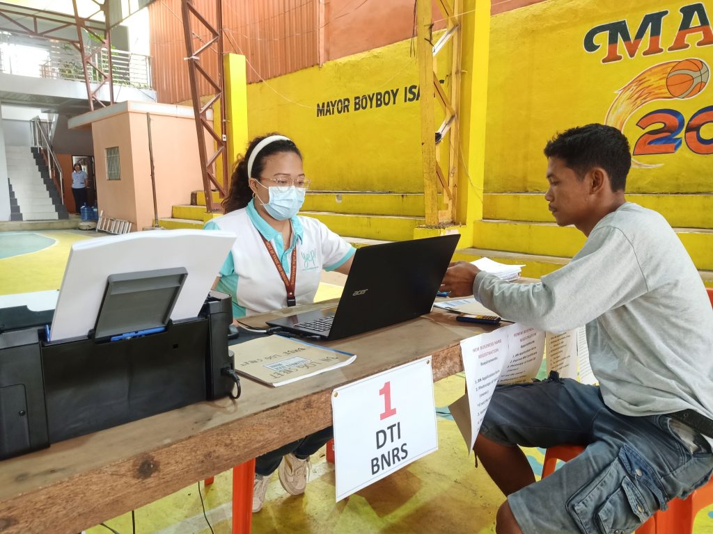 Negosyo Center Business Counselor assisting client in registering business name.