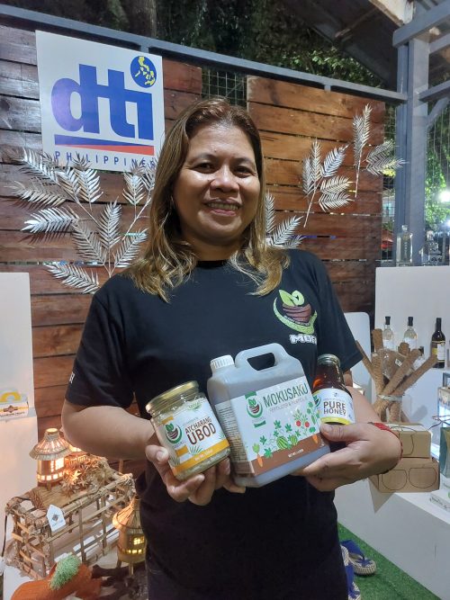 In Photo: Ms. Doyeth Valentin with their products Mokusako, Acharang Ubod and Pure Honey