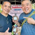 In Photo: Mr. Victor Esmeris with their local product lambanog