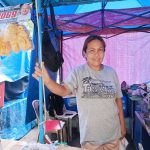 in photo: Mrs. Melody Llamas, owner of Llamas Frito's Food Stall