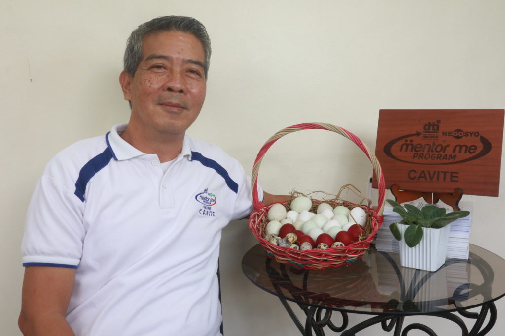 Mr. Jose Maria Fajardo with his primary product, salted egg.