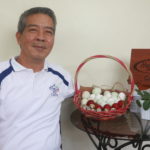 Mr. Jose Maria Fajardo with his primary product, salted egg.