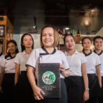 Triwil Herbs and Beans Café employees together with its owner