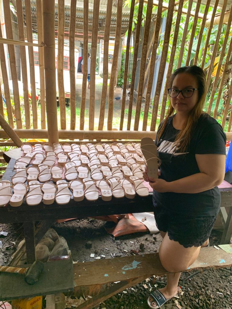 Ms. Jennifer Montejo together with her footwear products.