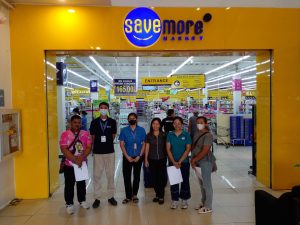 The Tayabas City Price Monitoring Team infront of a supermarket.