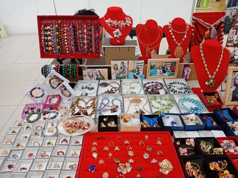 Jewelry of Dhelightful Creations Jewelry Collection spread out on a table presentably