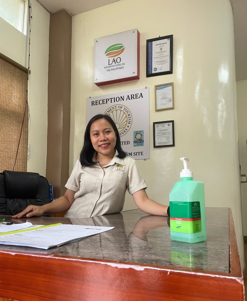 Donna Lao-Padre poses in the reception area at the Lao Integrated Farms office