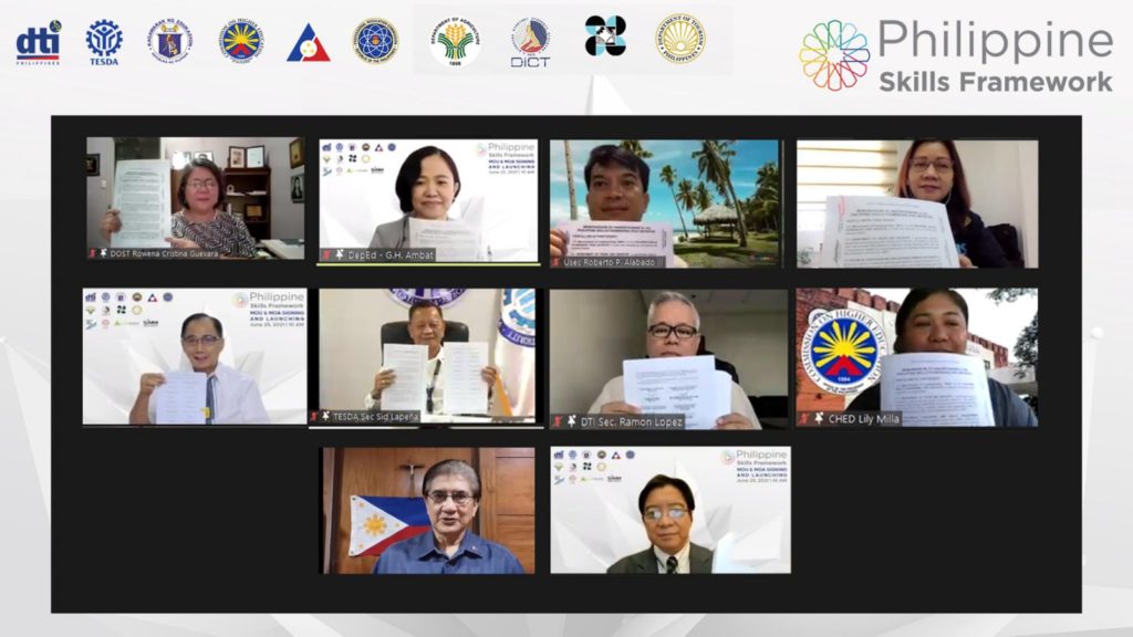 A group Zoom shot of the signatories of the Philippine Skills Framework MOU holding up their signed documents.
