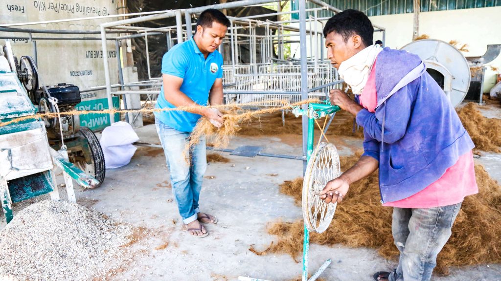 Cooperative members in the process of making coco coir.