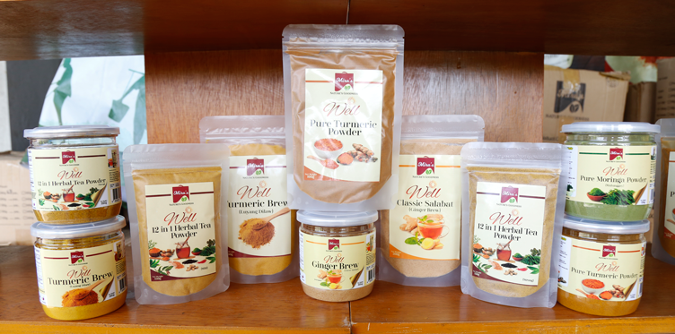 Some of Mira’s Turmeric Products including packs of herbal tea powder, pure moringo powder, and pure turmeric powder