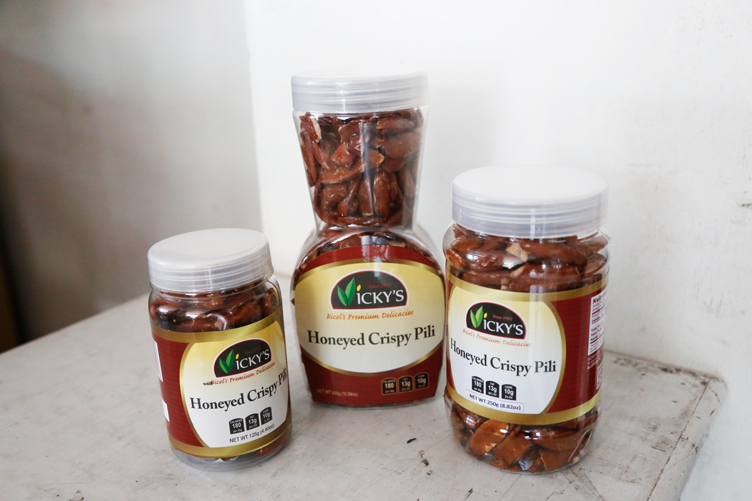 Vicky’s Pili and Food Products' honeyed crispy pili in bottles of various sizes