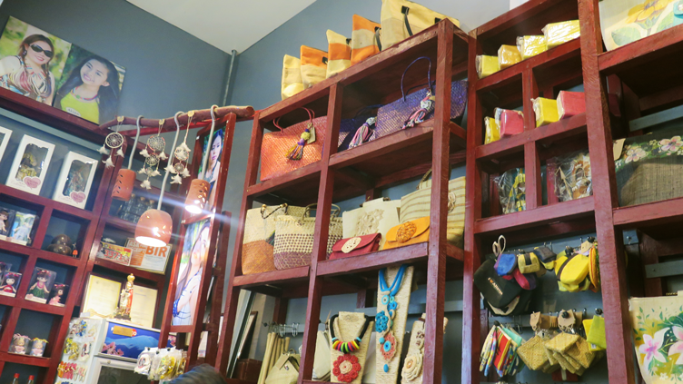 Shelves containing Buttons 'n Things' bestsellers: pouches, bags, and other accessories.